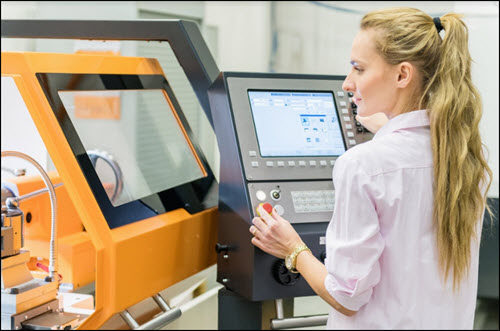 Employee working on CNC machine