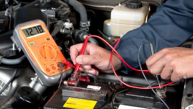 Man using a voltmeter