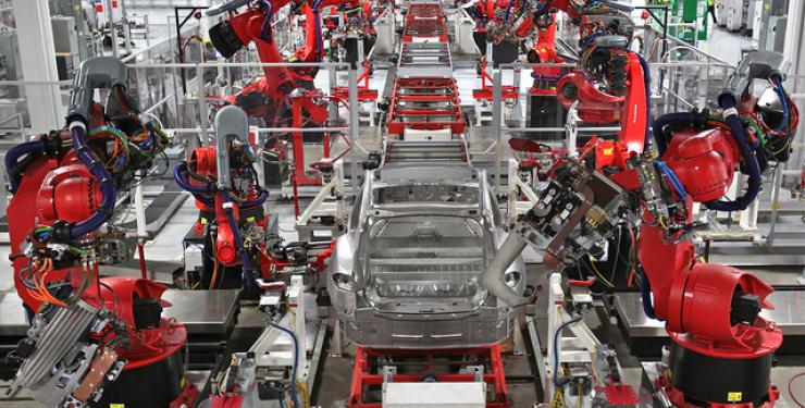 Tesla robots on assembly line